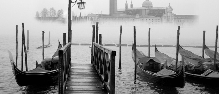 Venetian atmosphere in the fog with gondolas Venetian atmosphere in the fog with gondolas